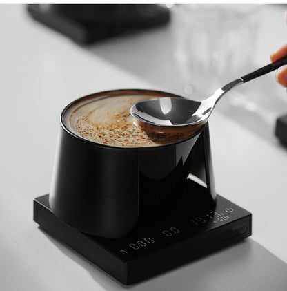 MHW-3BOMBER black cupping bowl with a spoon in a tasting scene
