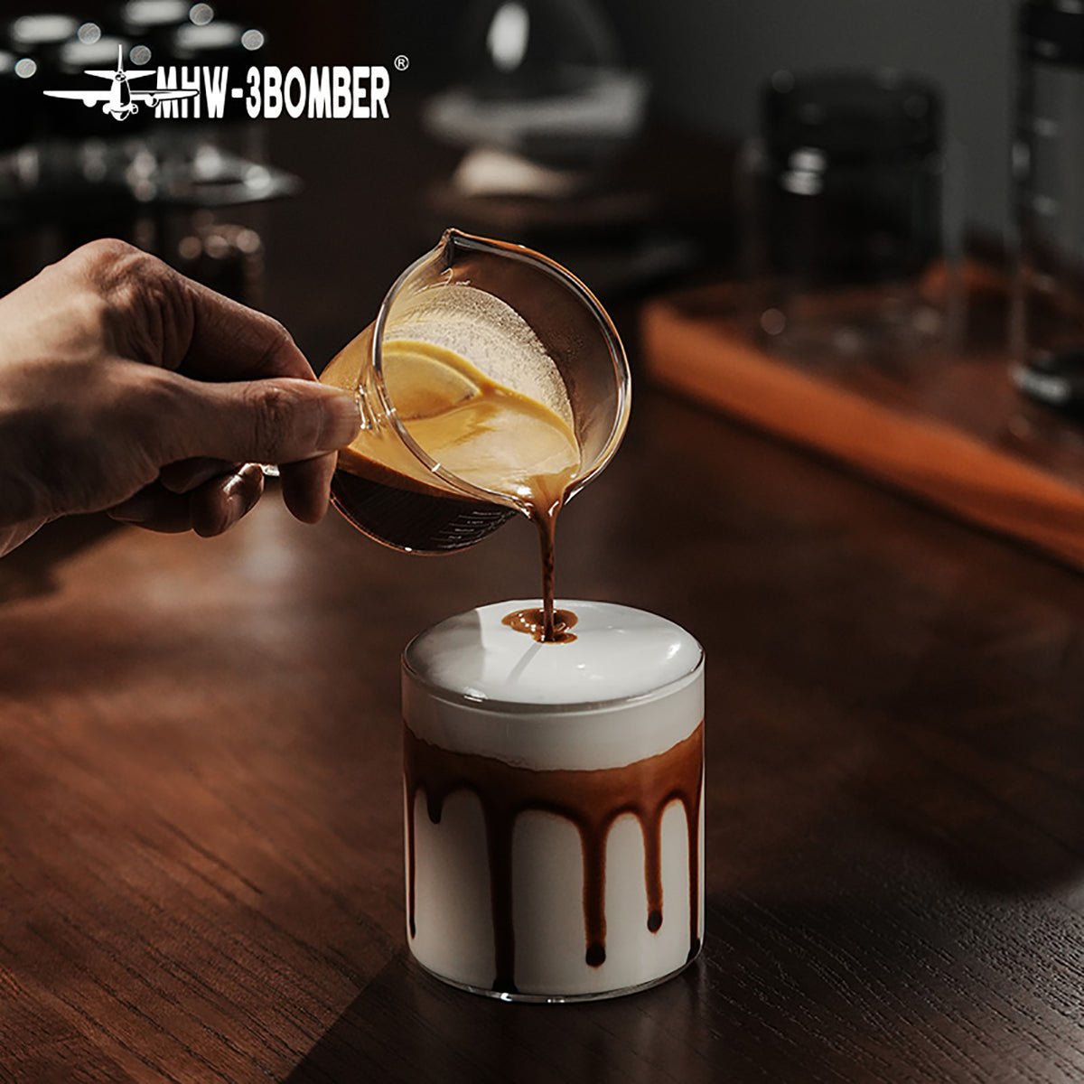 MHW-3BOMBER G5059 clear glass measuring cup pouring into a drink