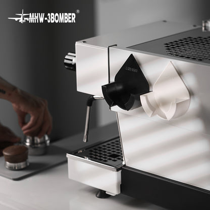 MHW-3BOMBER Black and White DPH holders mounted beside a coffee machine; family reference, machine and portafilters not included