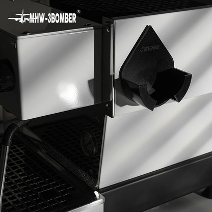 MHW-3BOMBER DPH5713B Black holder mounted beside a coffee machine; machine and portafilter not included