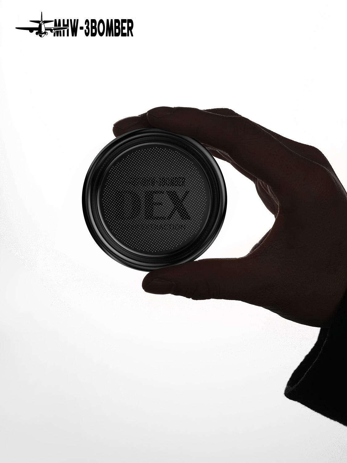 DEX filter basket held to show the perforated stainless-steel base