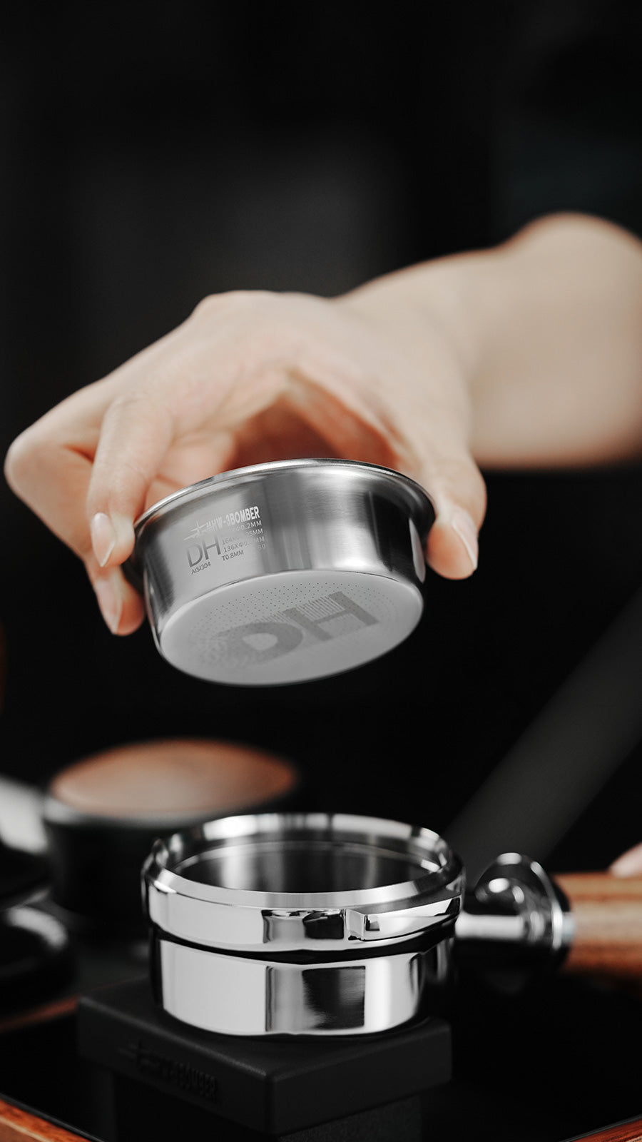 MHW-3BOMBER DH Silver basket held above a portafilter; portafilter not included