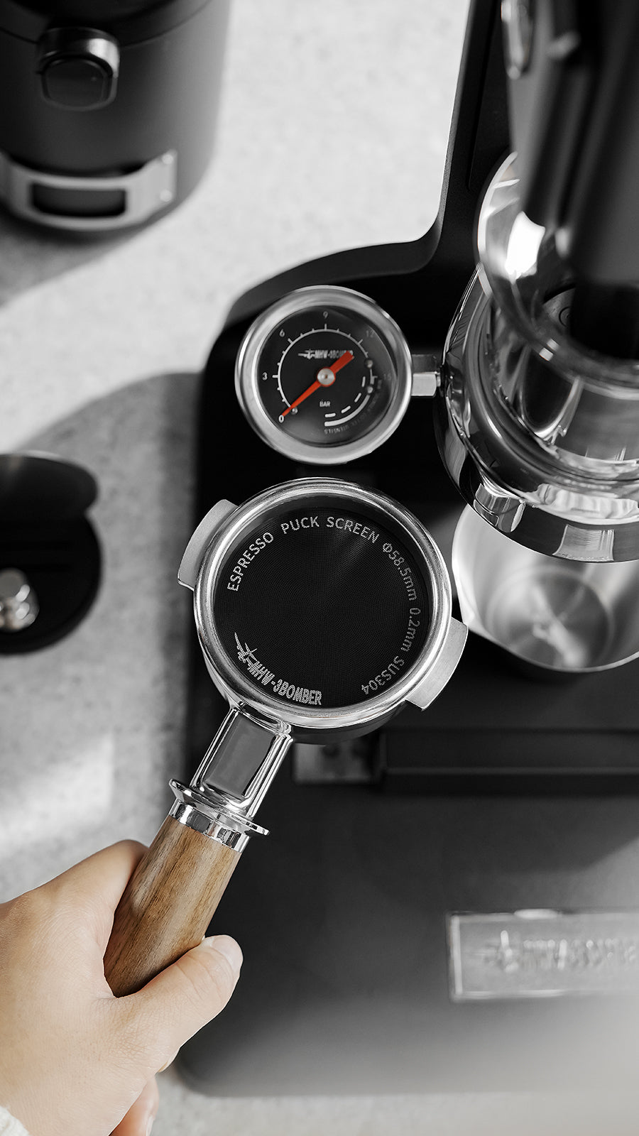MHW-3BOMBER FG5642 58.5mm 0.2mm black puck screen in a basket beside a pressure gauge; machine not included