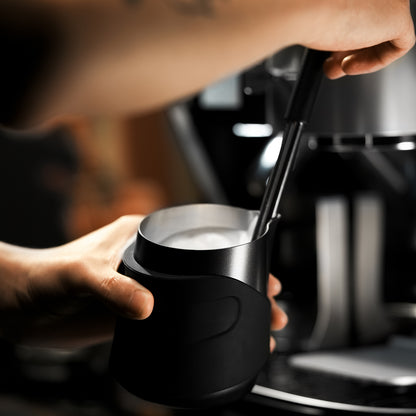 P6513B black handleless pitcher — milk steaming view