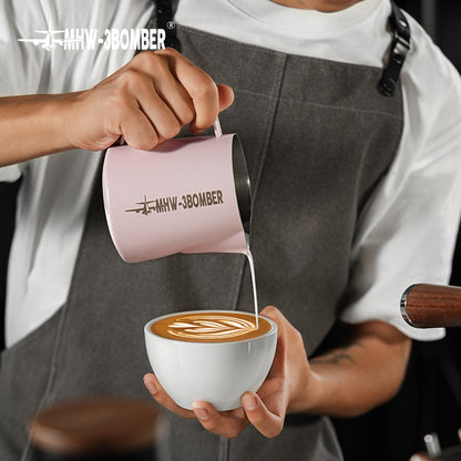 MHW-3BOMBER P5017 Milk Pitcher 5.0 — 500 ml solid pink, pouring into a white cup. Cups, machines and scene items are not included.