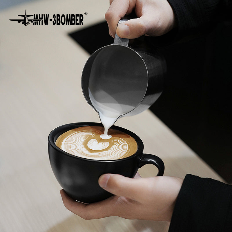 MHW-3BOMBER P5184 GT milk pitcher — 600 ml matte black, overhead latte pour. Cups, machines and scene items are not included.