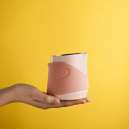 P6514P pink GT handleless 400 ml milk pitcher — hand-held on a yellow background. Cups and other scene items are not included.