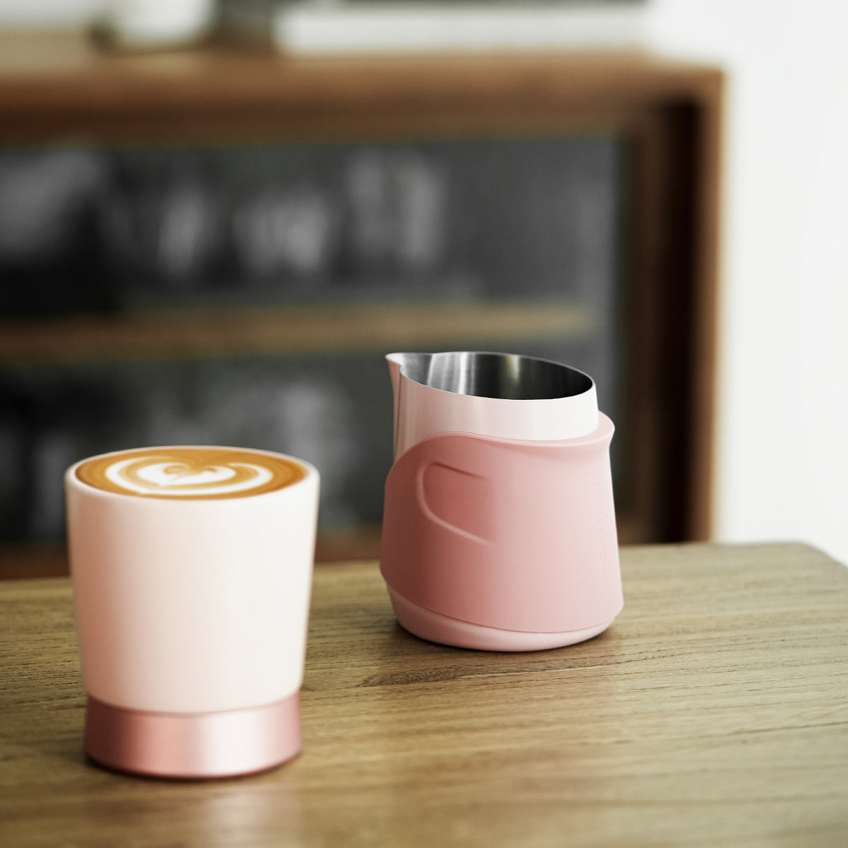 P6514P pink GT handleless 400 ml milk pitcher — on a counter beside a pink cup. Cups and other scene items are not included.
