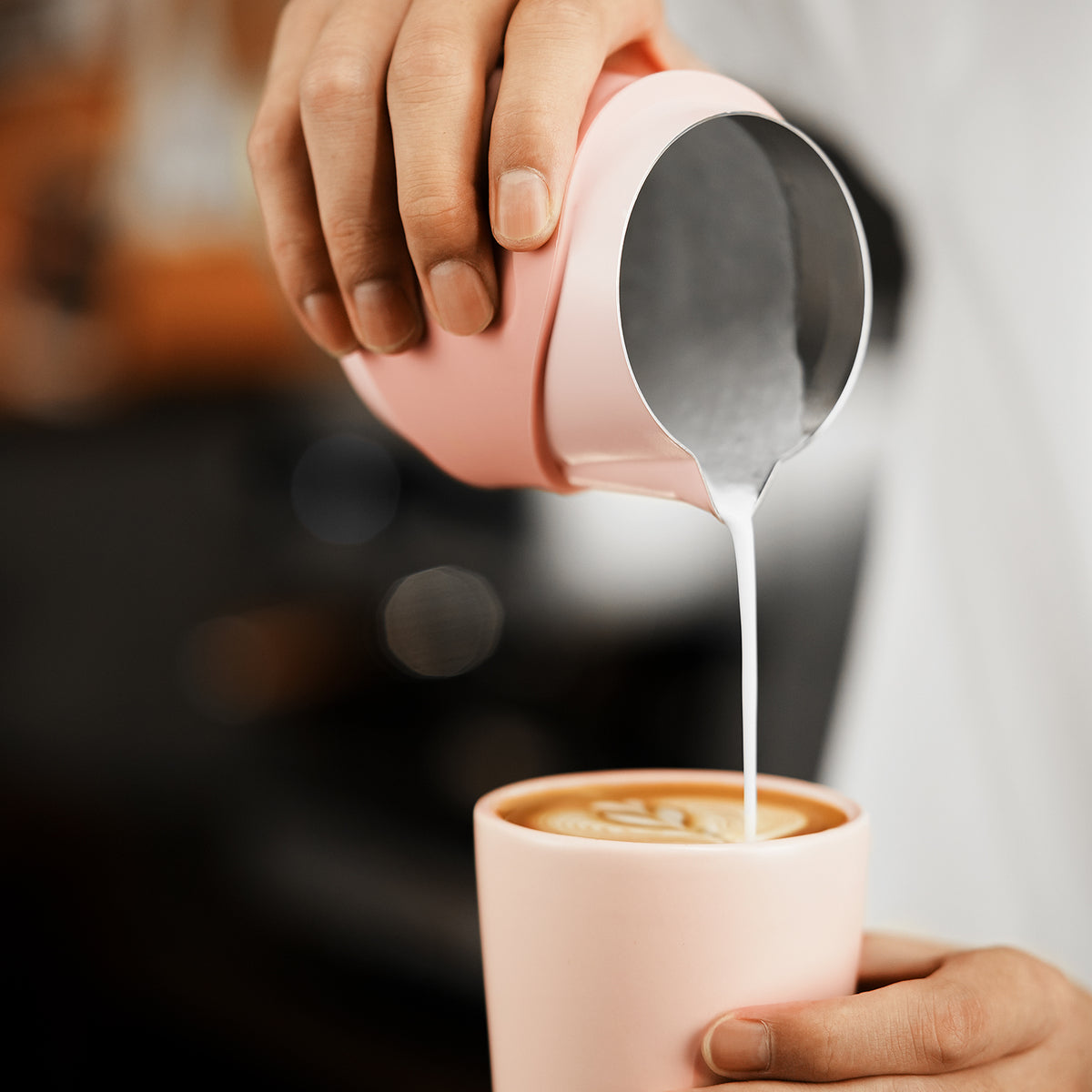 P6514P pink GT handleless 400 ml milk pitcher — close-up latte-art pouring. Cups and other scene items are not included.