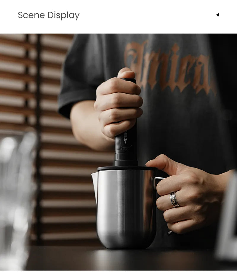 Magician open-handle pitcher in use with a separate frother; frother not included