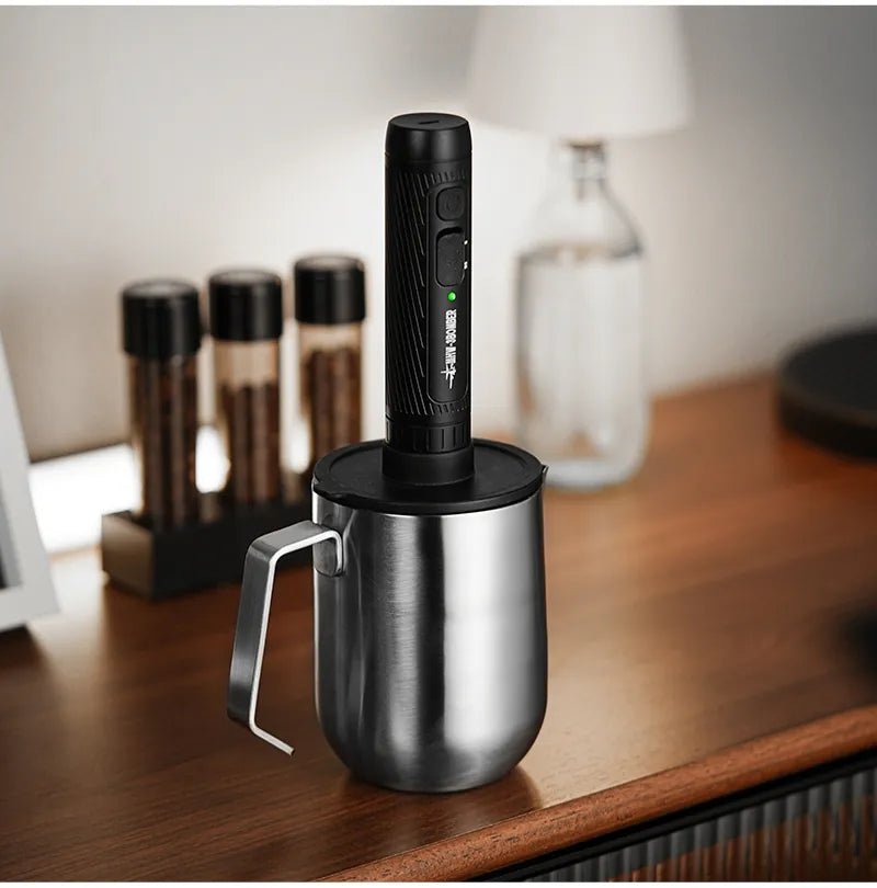 Magician open-handle pitcher on a counter with a separate frother; frother not included