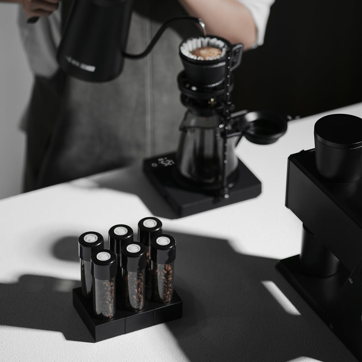 MHW-3BOMBER SR6680 black magnetic bases in pour-over service; one base only, all bottles and brewing tools separate