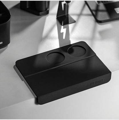 MHW-3BOMBER SP5309B black B-style tamping mat placed on a counter edge