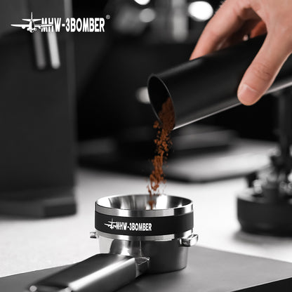 MHW-3BOMBER T5830 dosing ring on a portafilter resting on a worktop during grounds transfer