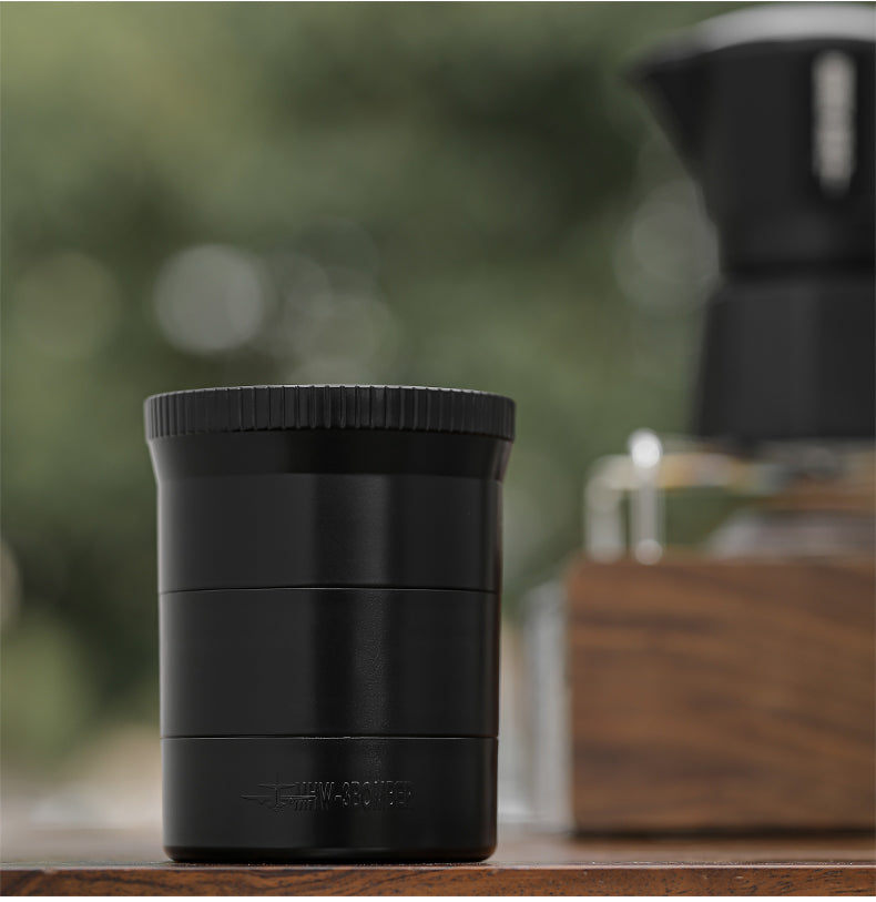 MHW-3BOMBER T5884 black cyclone moka coffee distributor on a worktop