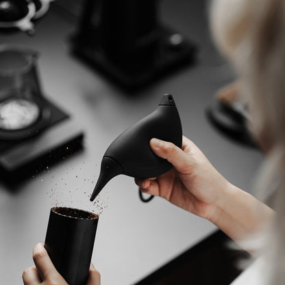 MHW-3BOMBER AB6721B black Bird Air Blower held beside a grinder catch cup; grinder not included