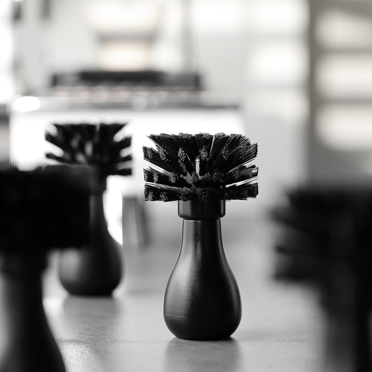 MHW-3BOMBER B5535/B5536 ABS basket-brush family on a coffee counter, bristle and handle view