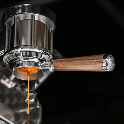 MHW-3BOMBER BP6083L walnut La Marzocco / E61 bottomless portafilter, underside espresso extraction; other equipment, coffee and accessories are scene props