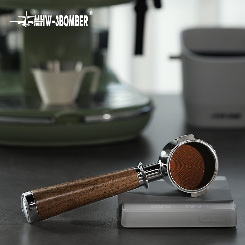 BP6083L walnut bottomless portafilter resting on a preparation scale; scale and other scene equipment are not included and the photo is not net-weight evidence.