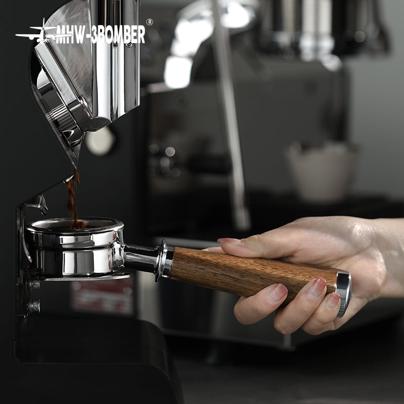 BP6083L walnut bottomless portafilter held at a compatible grouphead before locking in; machine is not included; confirm exact grouphead fit before ordering.