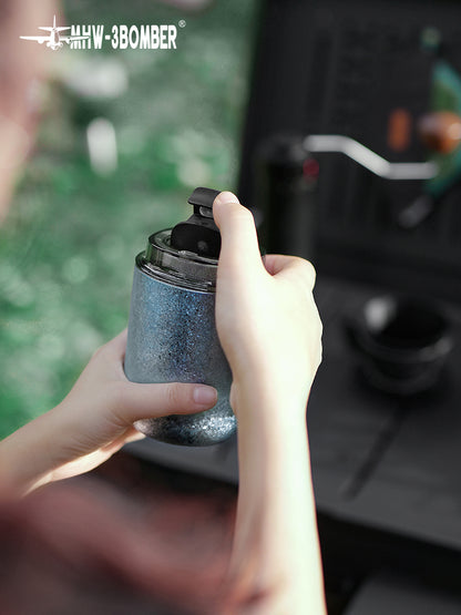 MHW-3BOMBER Blue Titanium Cup held in both hands