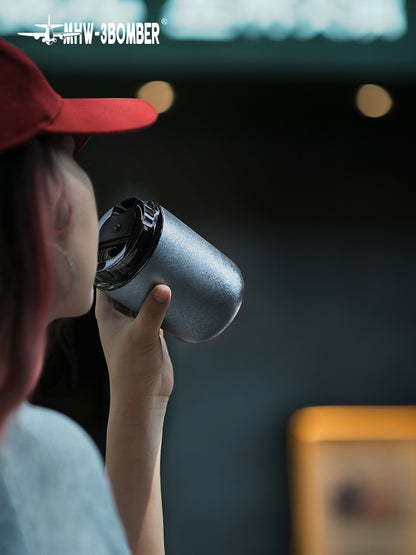 MHW-3BOMBER Blue Titanium Cup being used for drinking