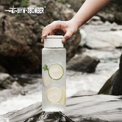 MHW-3BOMBER CE6136 White cold-brew pot containing a citrus drink on an outdoor table; scene tools, glasses and drink ingredients are not included.
