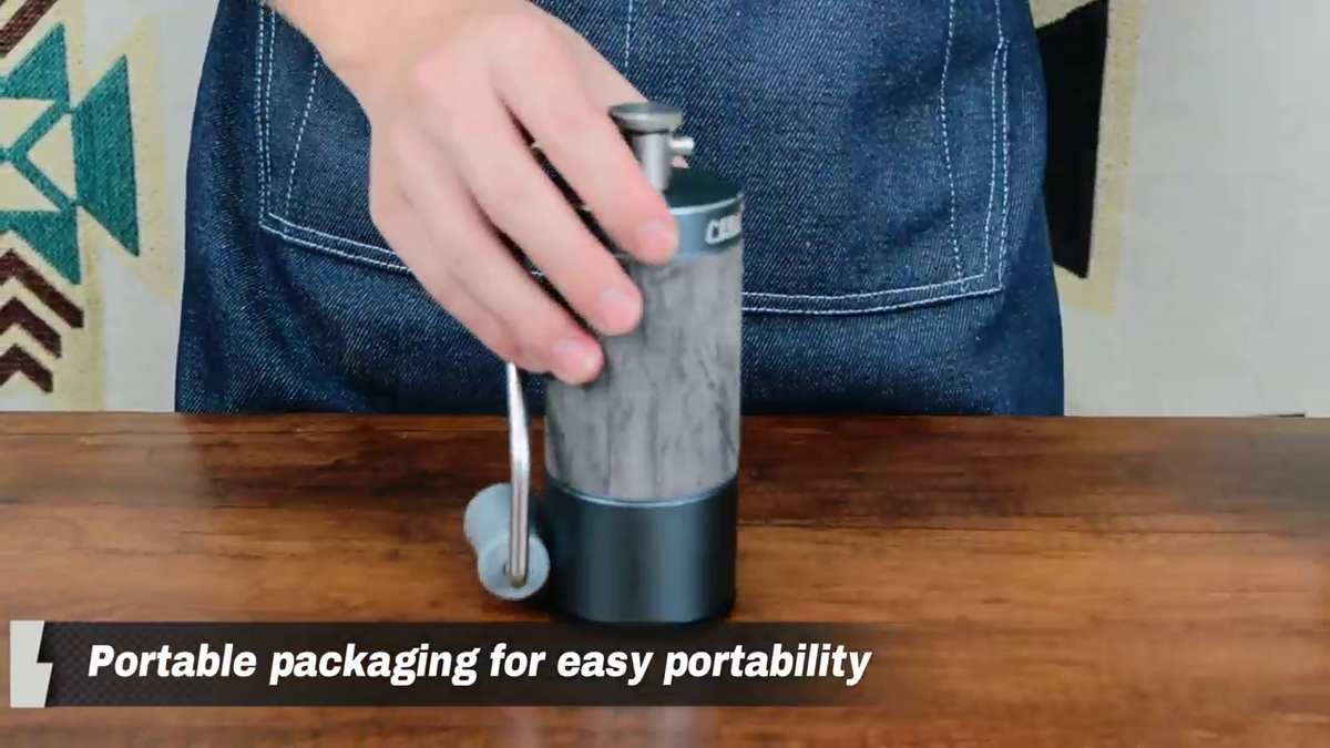 CERA+ CG01 Space Grey manual coffee grinder with its handle folded for storage