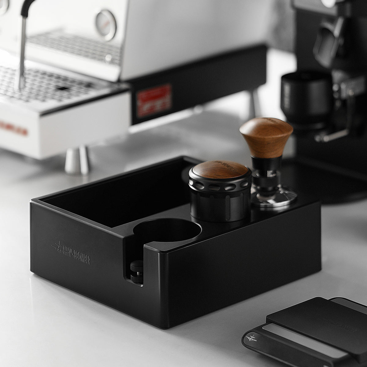 MHW-3BOMBER CH6625 beside an espresso machine and holder tools; pictured portafilter, tampers and other tools are not included.