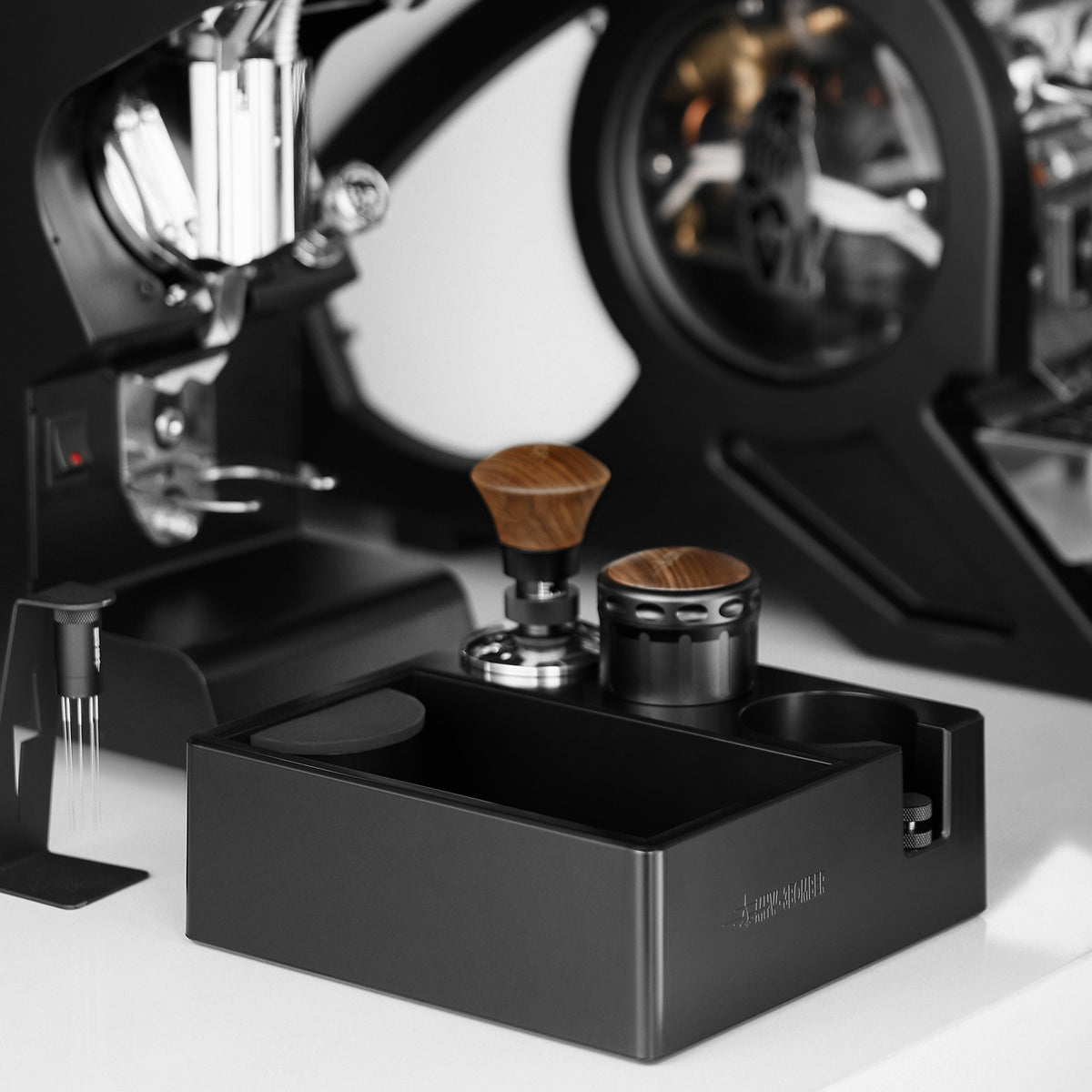 MHW-3BOMBER CH6625 with a portafilter and preparation tools alongside an espresso machine; pictured portafilter, tampers and other tools are not included.