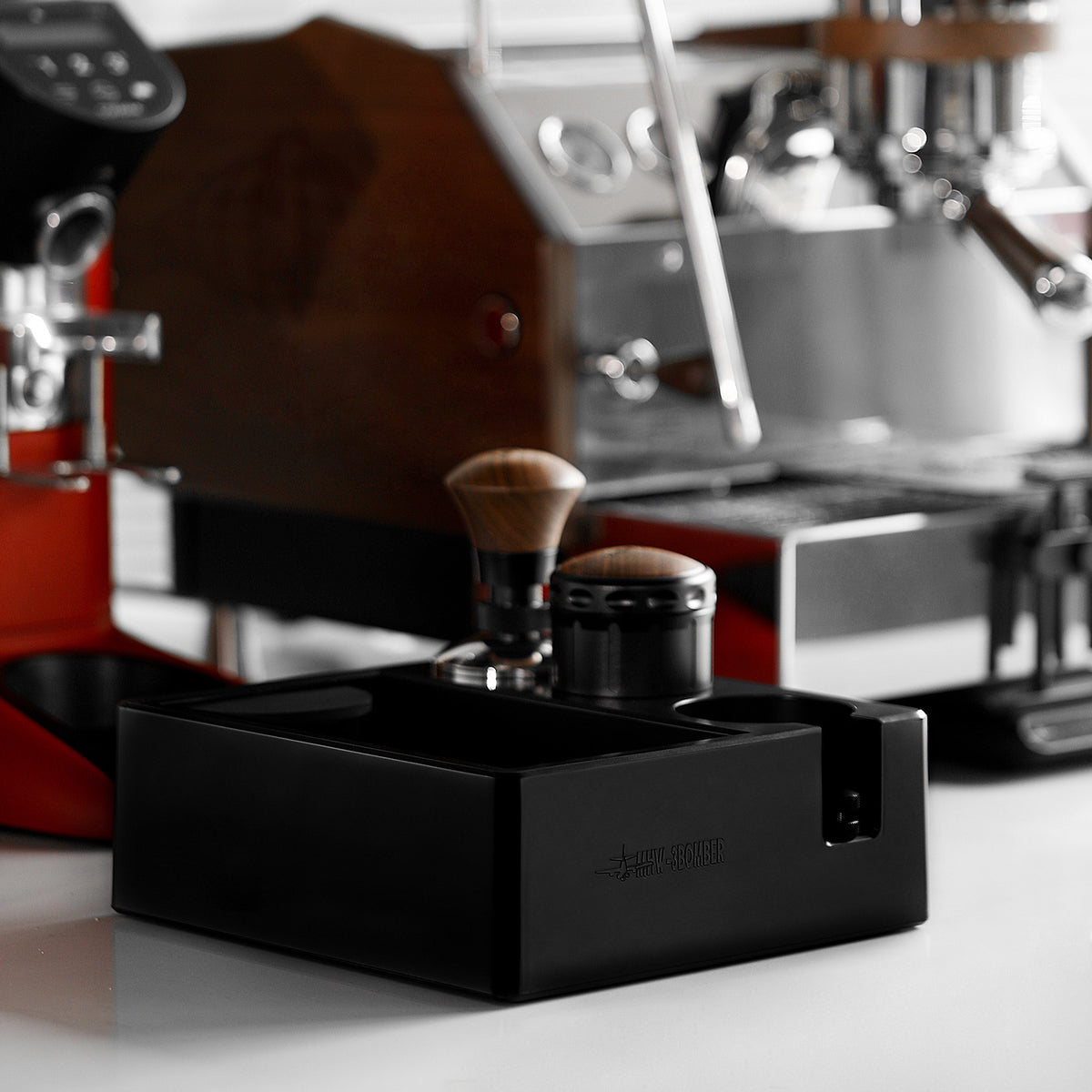 MHW-3BOMBER CH6625 in a coffee-preparation setup with a tamper on its stand; pictured portafilter, tampers and other tools are not included.