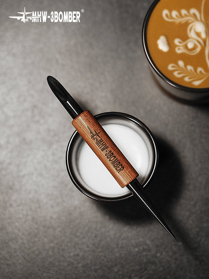 MHW-3BOMBER CN5400R latte art pen resting on a milk-foam container