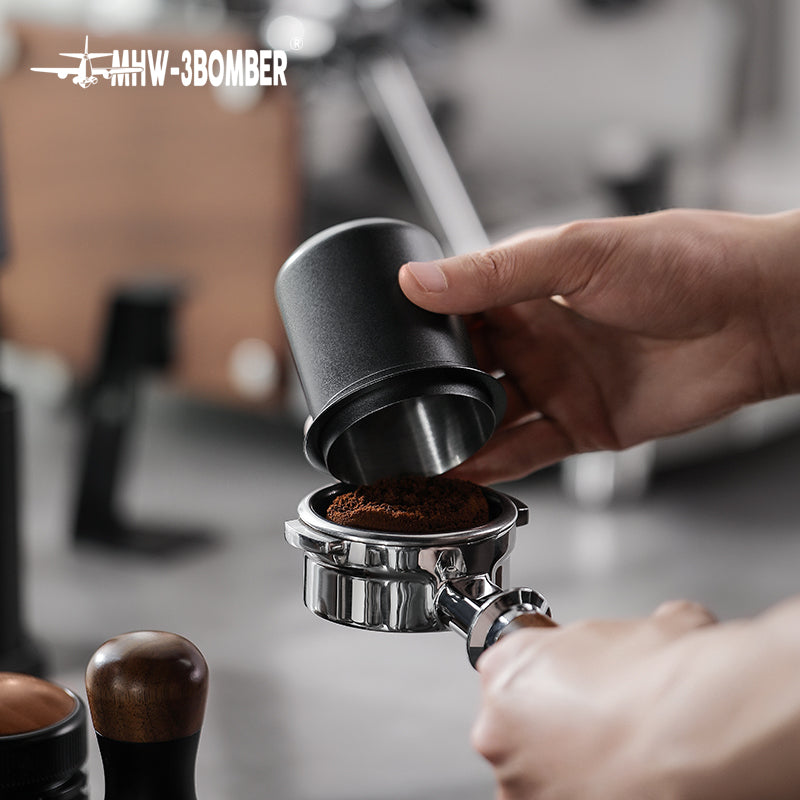 MHW-3BOMBER DC5615B matte black dosing cup being positioned on a portafilter; portafilter not included