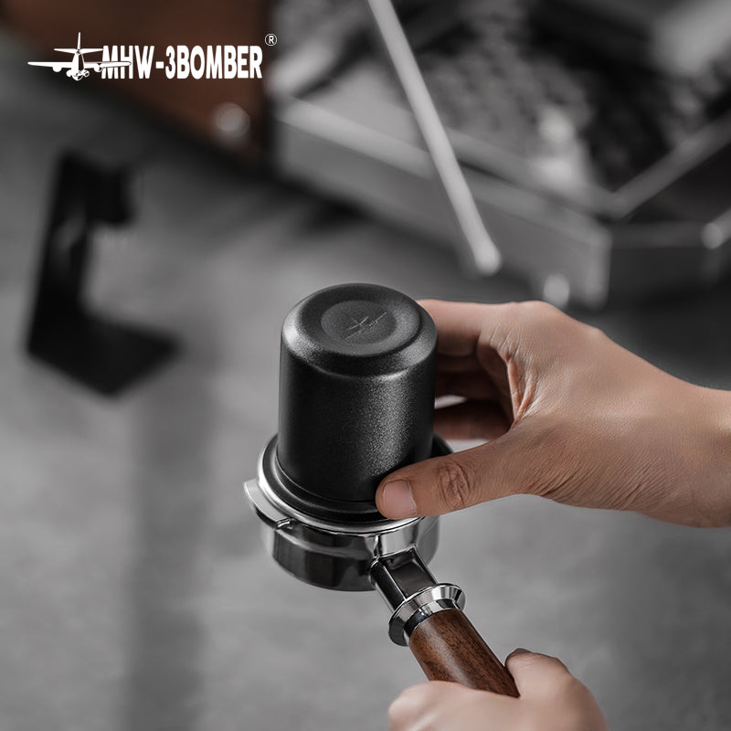 MHW-3BOMBER DC5615B matte black dosing cup inverted on a portafilter; other equipment not included