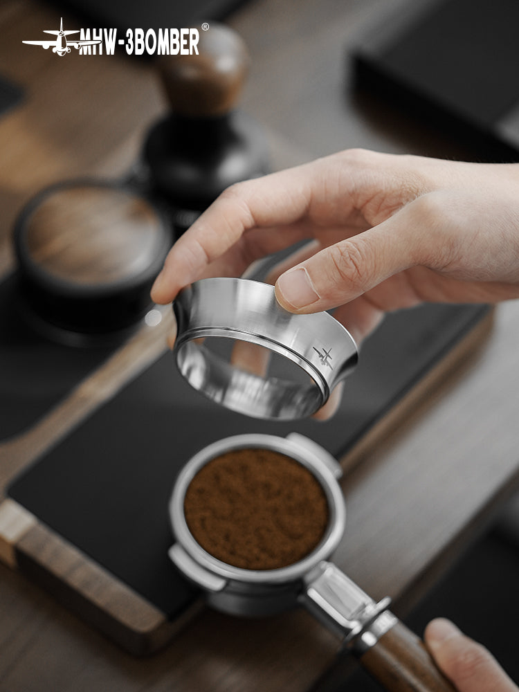 MHW-3BOMBER silver steel ring lifted from a coffee-filled portafilter; portafilter separate