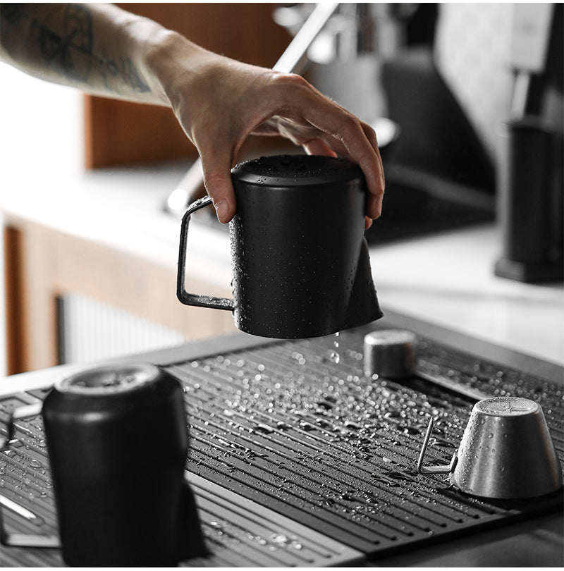MHW-3BOMBER coffee server being placed on a drying pad; server not included