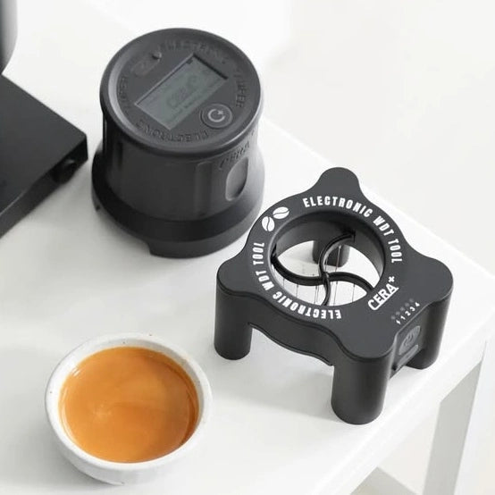CERA+ ED58 beside a separate tamper and cup; demonstration equipment not included