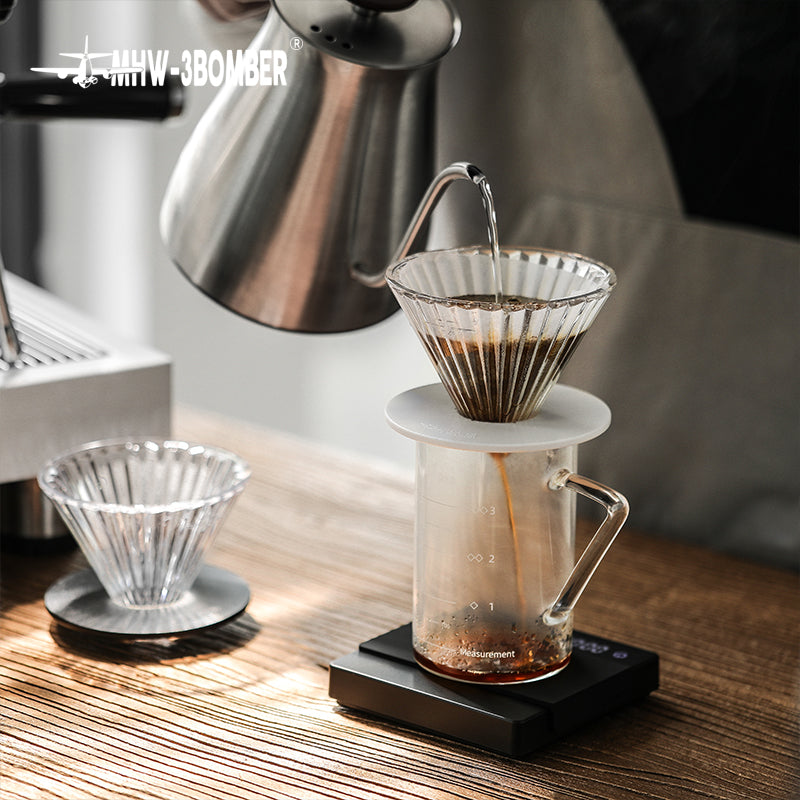 MHW-3BOMBER FC5875W Elf Glass Dripper — pour-over setup with the clear white-base dripper in use