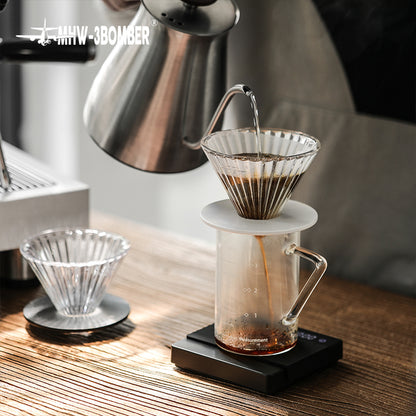 MHW-3BOMBER FC5875W Elf Glass Dripper — pour-over setup with the clear white-base dripper in use