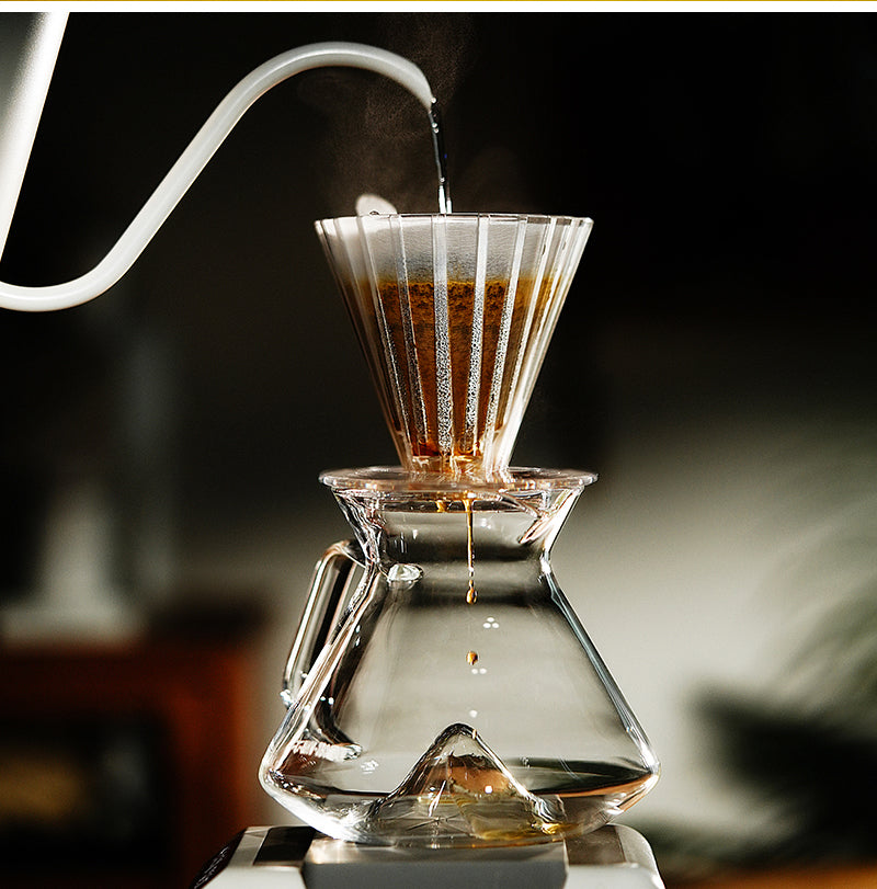 MHW-3BOMBER clear Oval dripper brewing on a coffee server