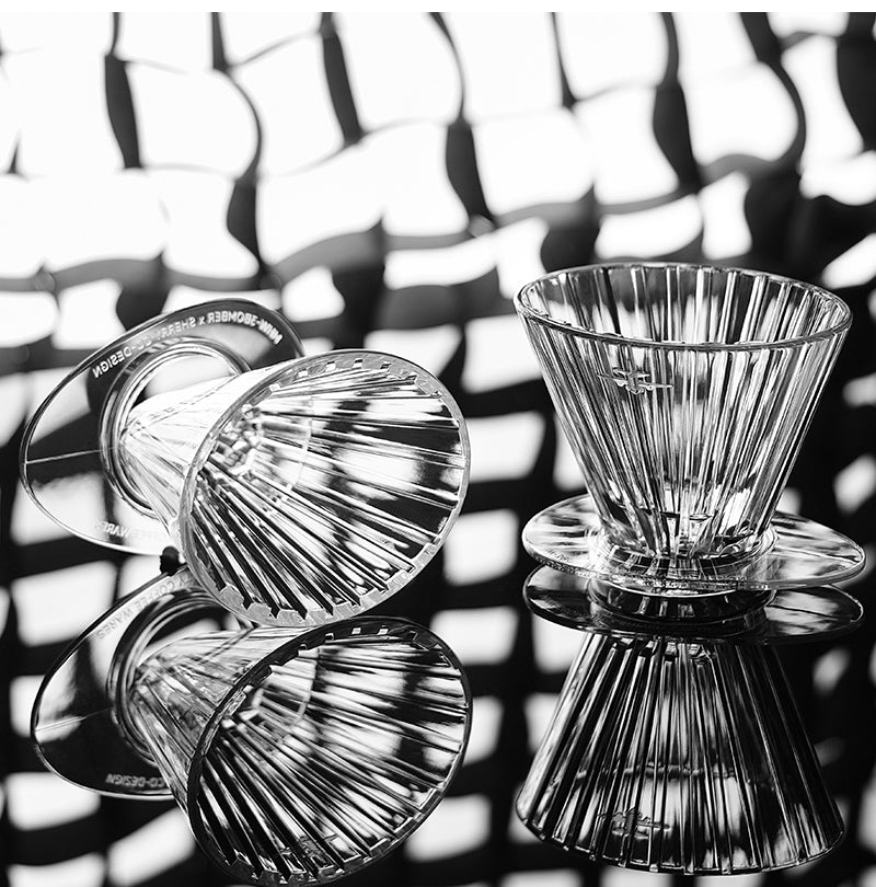 MHW-3BOMBER clear Oval drippers displayed on a reflective surface