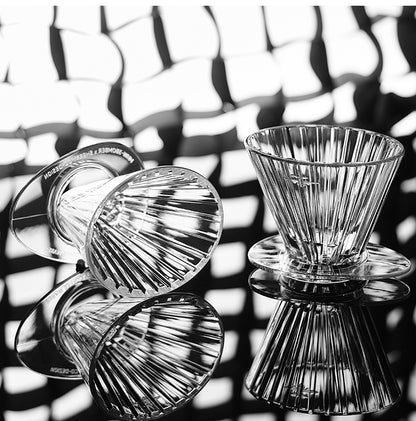MHW-3BOMBER clear Oval drippers displayed on a reflective surface