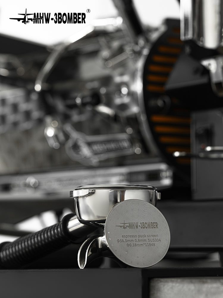 MHW-3BOMBER FG5590 silver 58.5mm 0.8mm puck screen beside a portafilter; portafilter not included