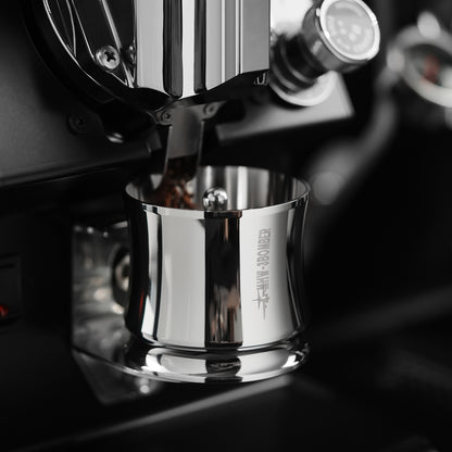 MHW-3BOMBER silver FlowLight dosing tool below a coffee grinder