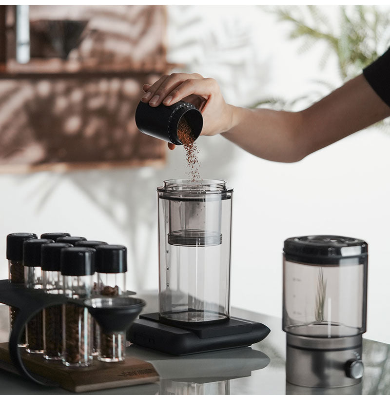 MHW-3BOMBER clear Fresh Ice brewer being filled with coffee grounds
