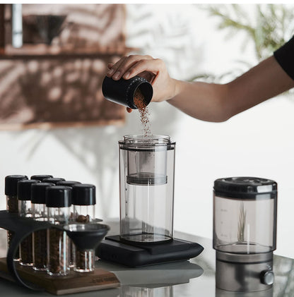 MHW-3BOMBER clear Fresh Ice brewer being filled with coffee grounds