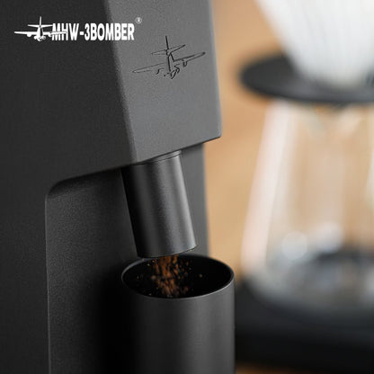 MHW-3BOMBER G5867B Black Sniper dispensing ground coffee into its dosing cup