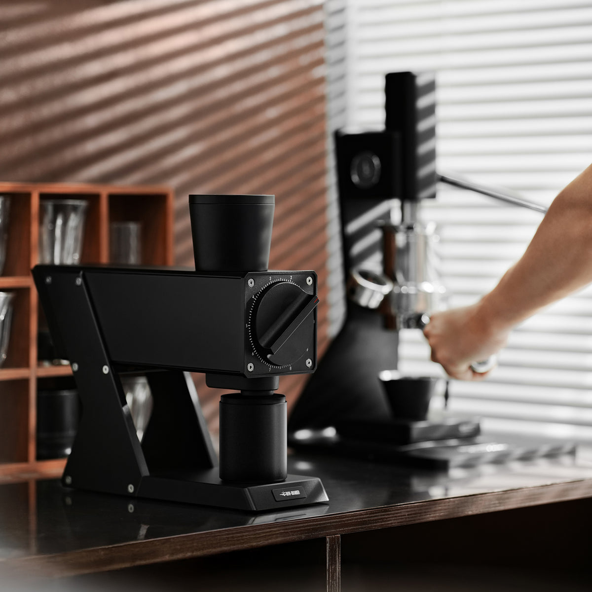 MHW-3BOMBER F74 Navigator G5917 Black grinder, front view on a coffee counter