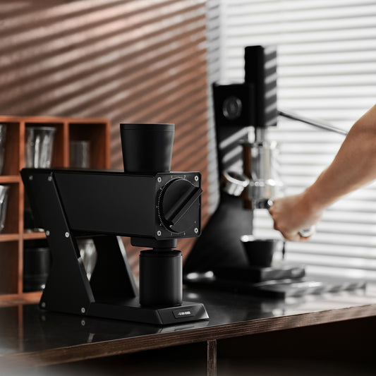 MHW-3BOMBER F74 Navigator G5917 Black grinder, front view on a coffee counter