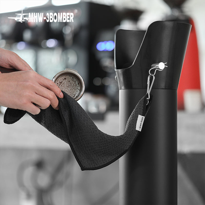 Portafilter wiping workflow beside the GB5449 bin and towel hook